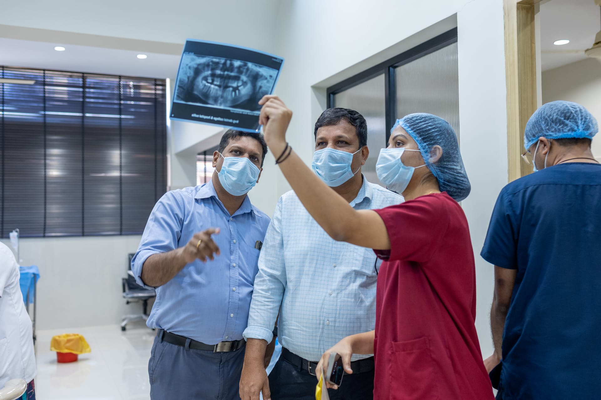 Specialists reviewing implant diagnostics